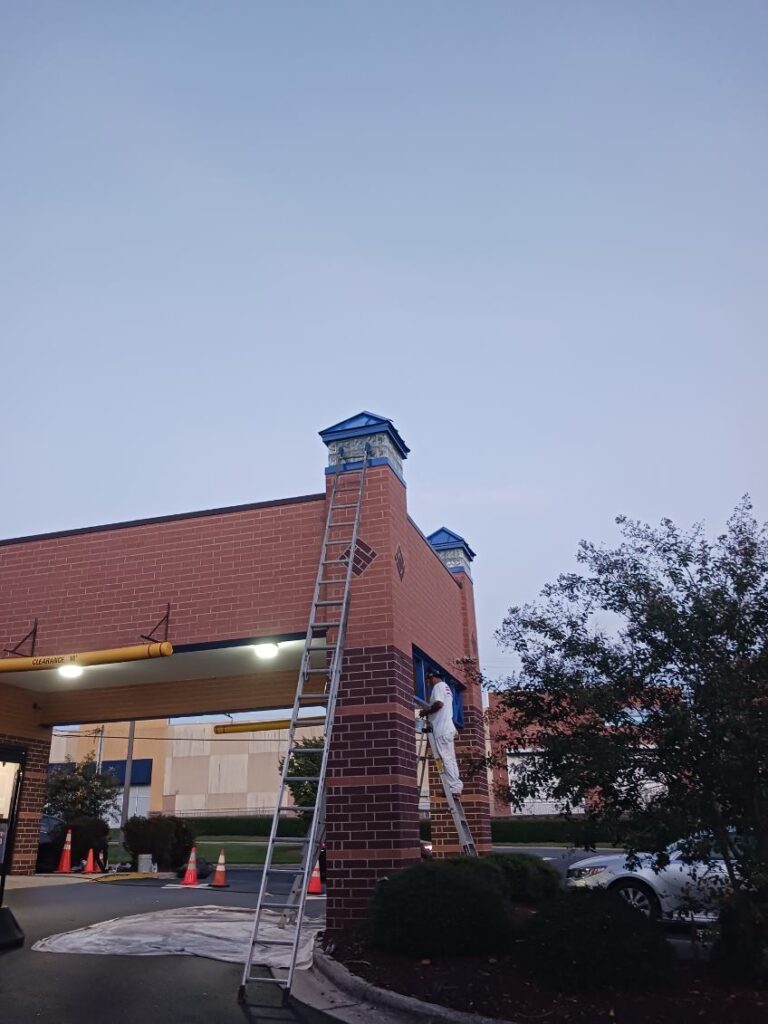 Painting a commercial building.